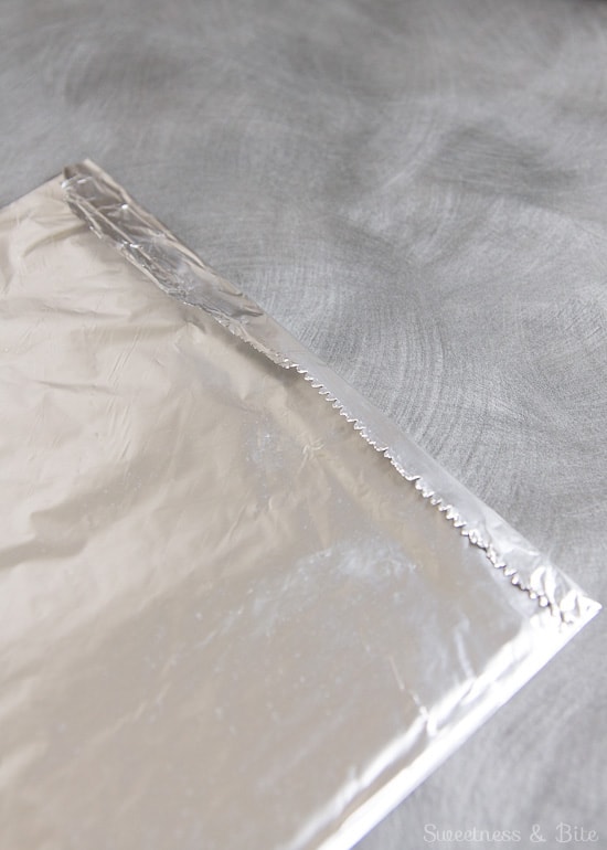 The edge of the foil folded over the paper towels.