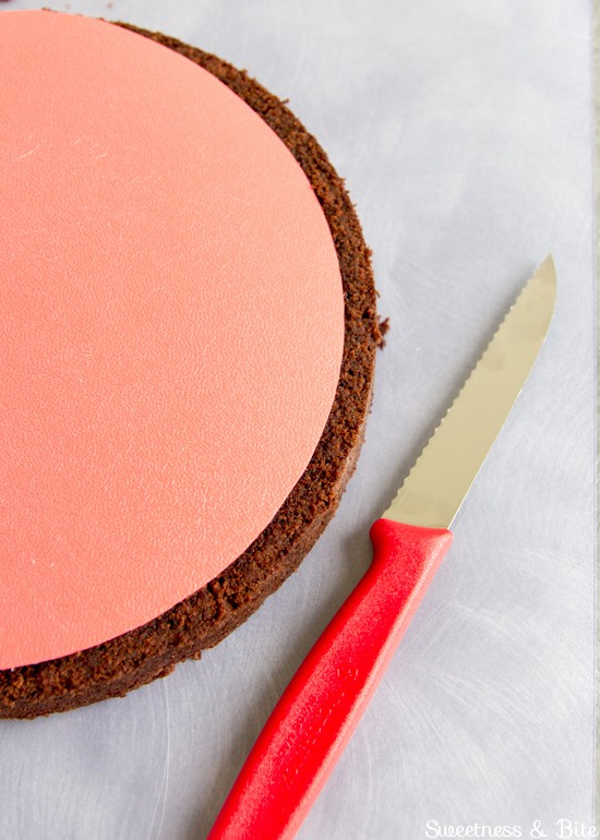 Trimming the cake layers with a small serrated knife.