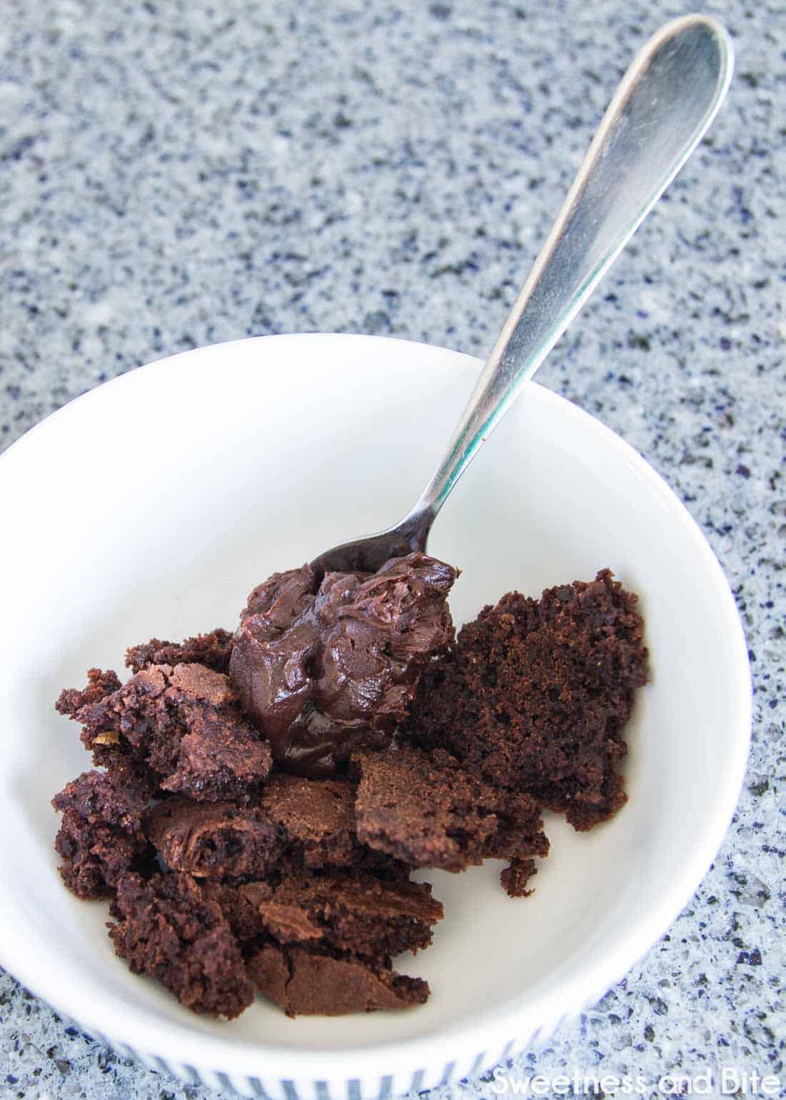 Cake offcuts being mixed with ganache. 