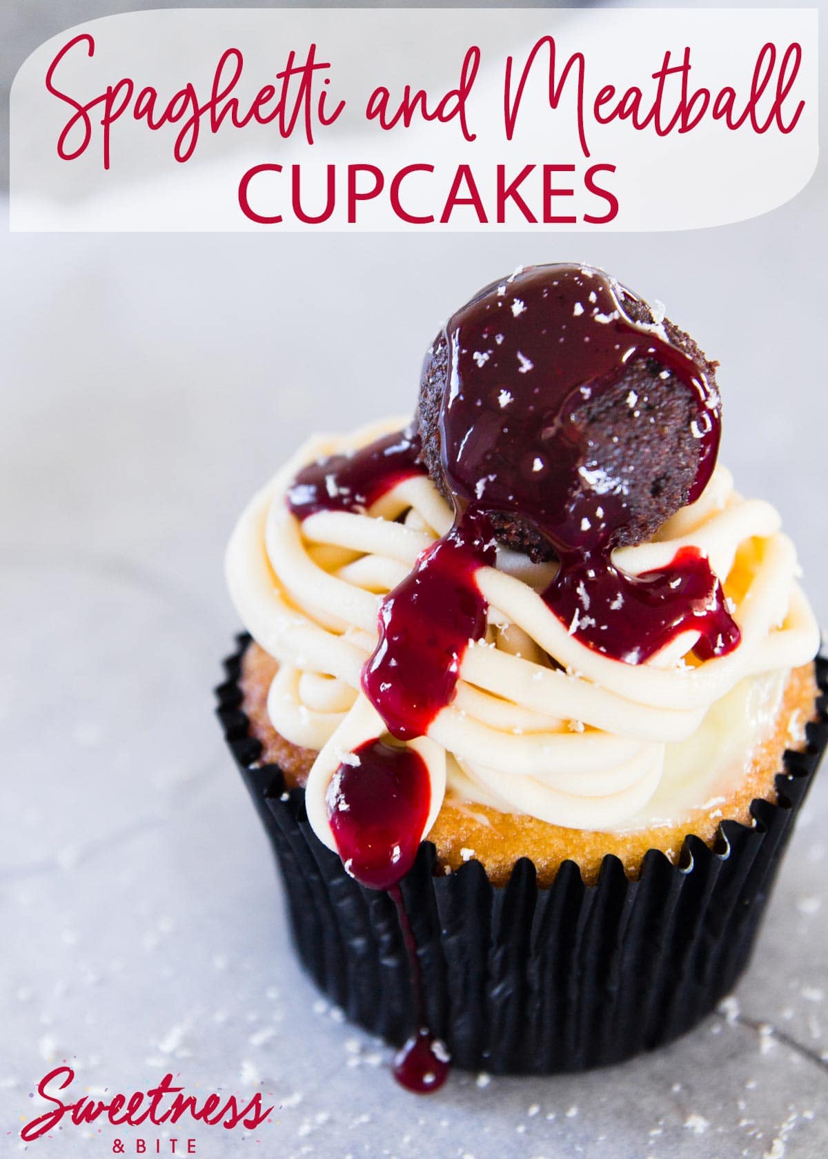 A cupcake, topped with modelling chocolate spaghetti, a cake pop 