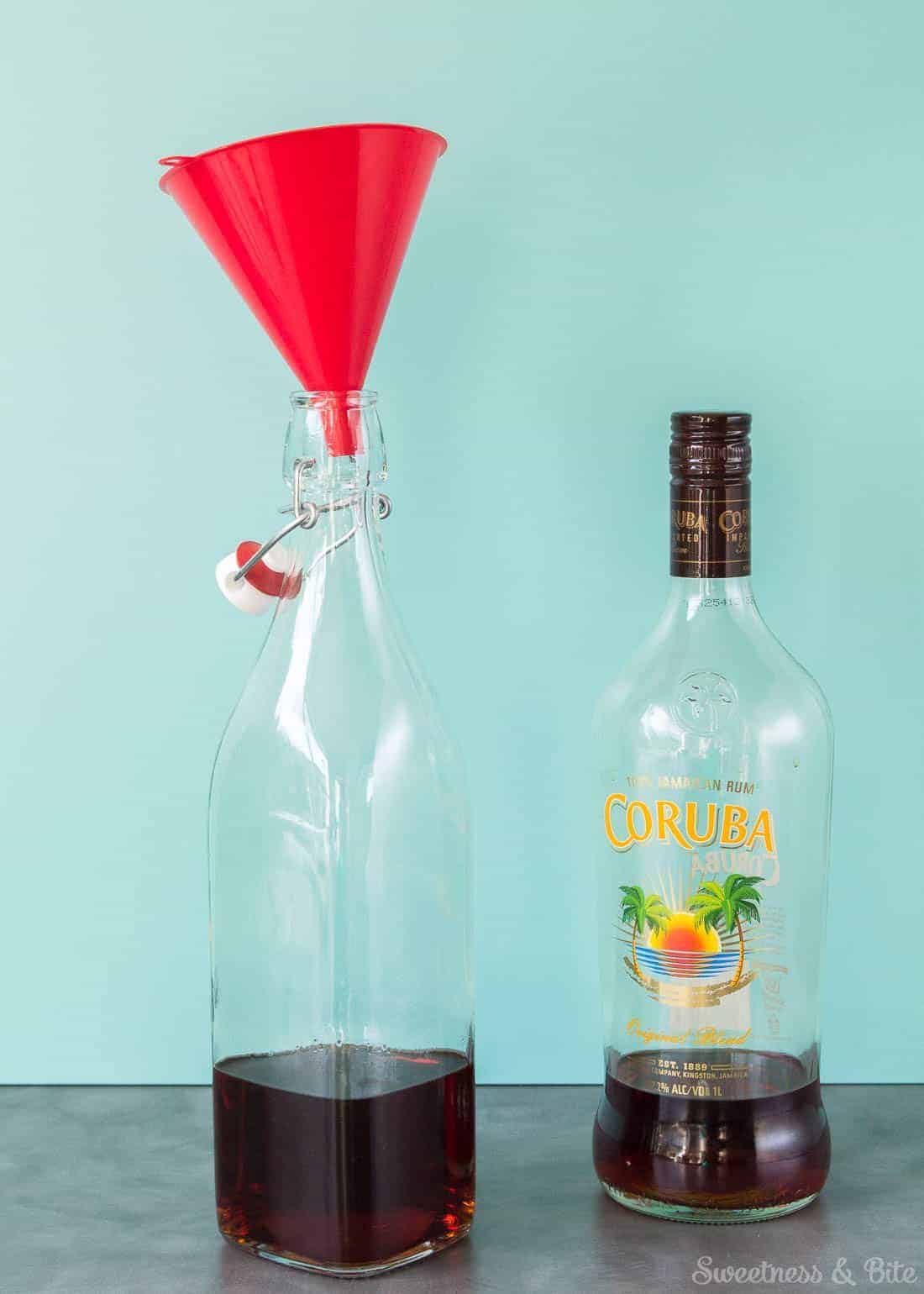 A swing-top bottle 1/4 full of rum.