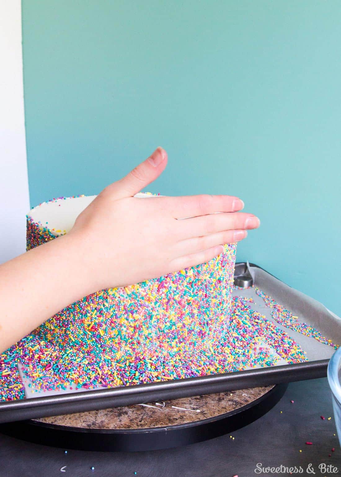 Sprinkle Cake Tutorial - A step by step guide to applying sprinkles to a fondant covered cake ~ Sweetness and Bite