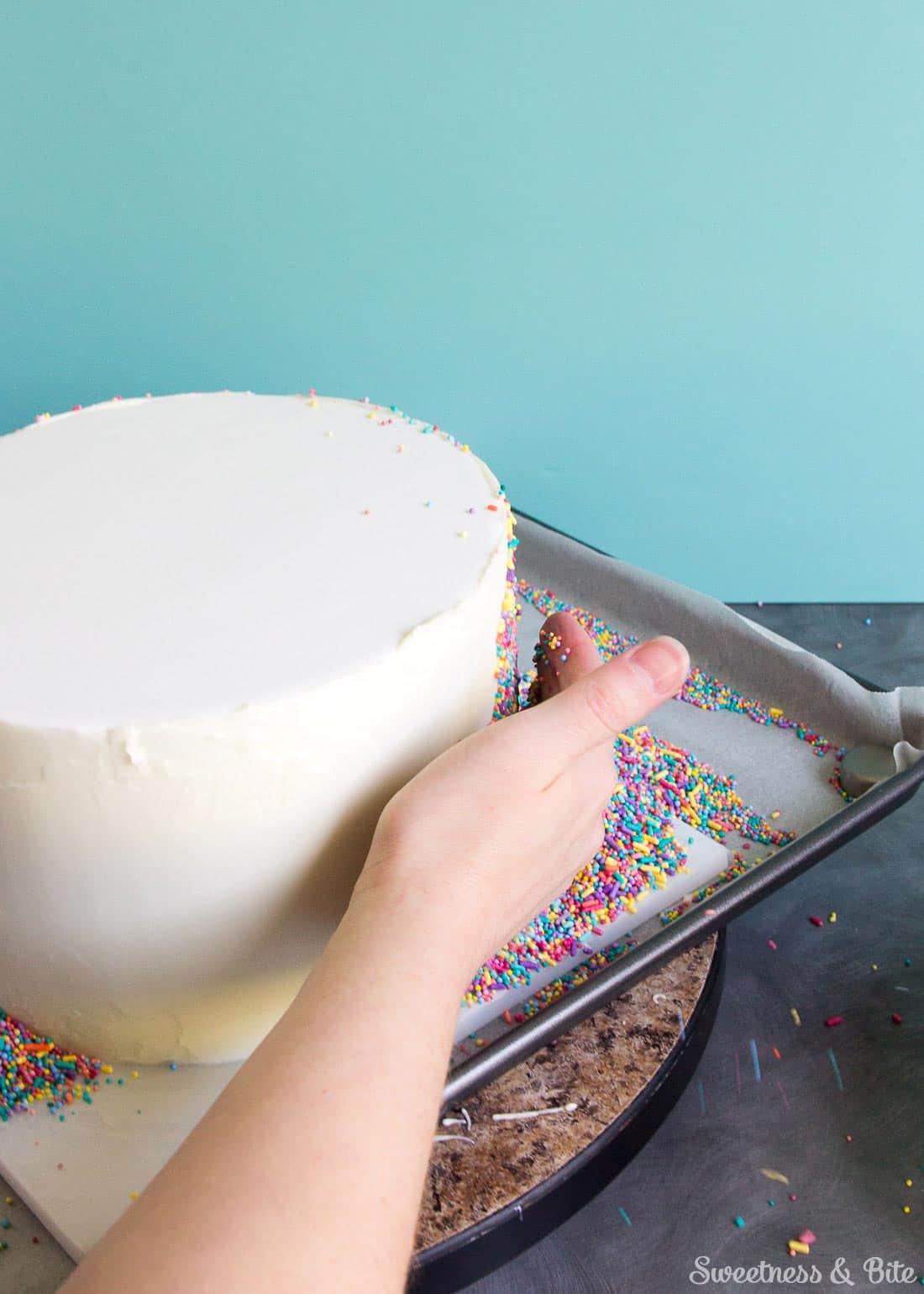 Sprinkle Cake Tutorial - A step by step guide to applying sprinkles to a fondant covered cake ~ Sweetness and Bite