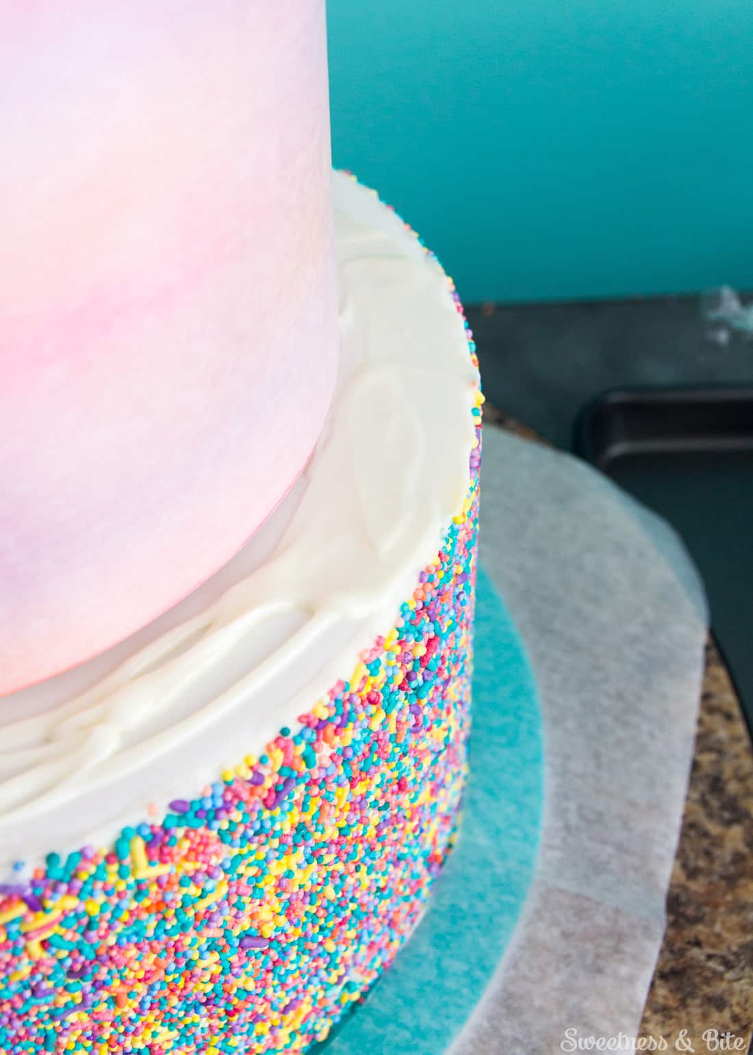 Sprinkle Cake Tutorial - A step by step guide to applying sprinkles to a fondant covered cake ~ Sweetness and Bite