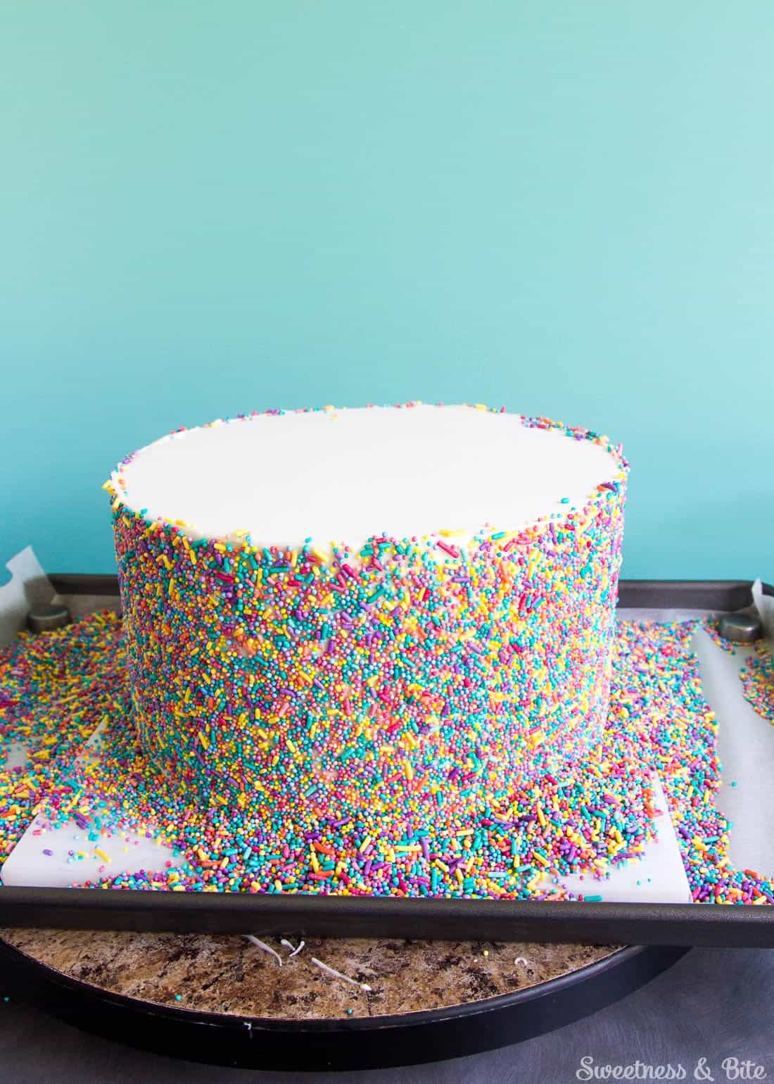 Sprinkle Cake Tutorial - A step by step guide to applying sprinkles to a fondant covered cake ~ Sweetness and Bite