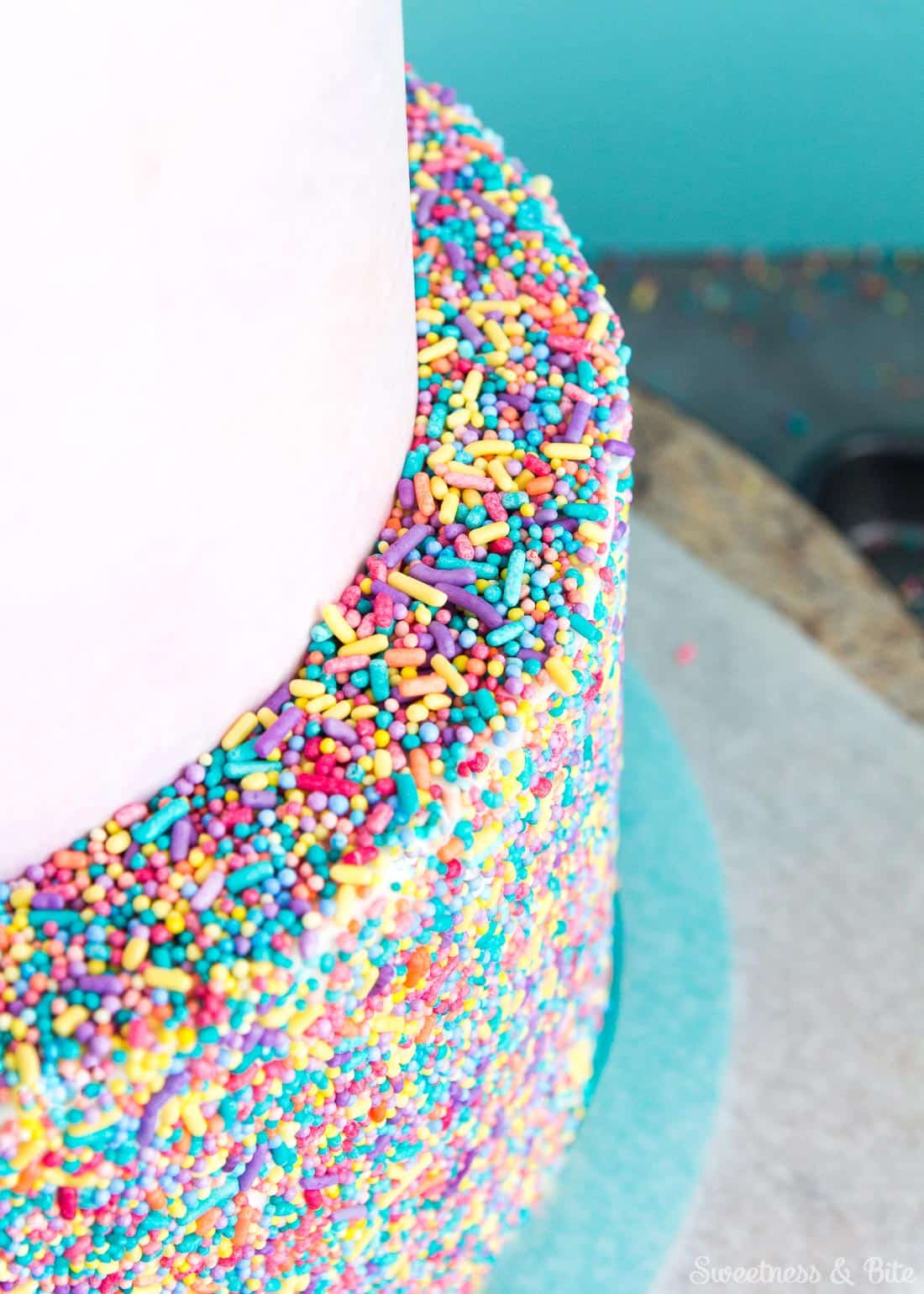 Sprinkle Cake Tutorial - A step by step guide to applying sprinkles to a fondant covered cake ~ Sweetness and Bite