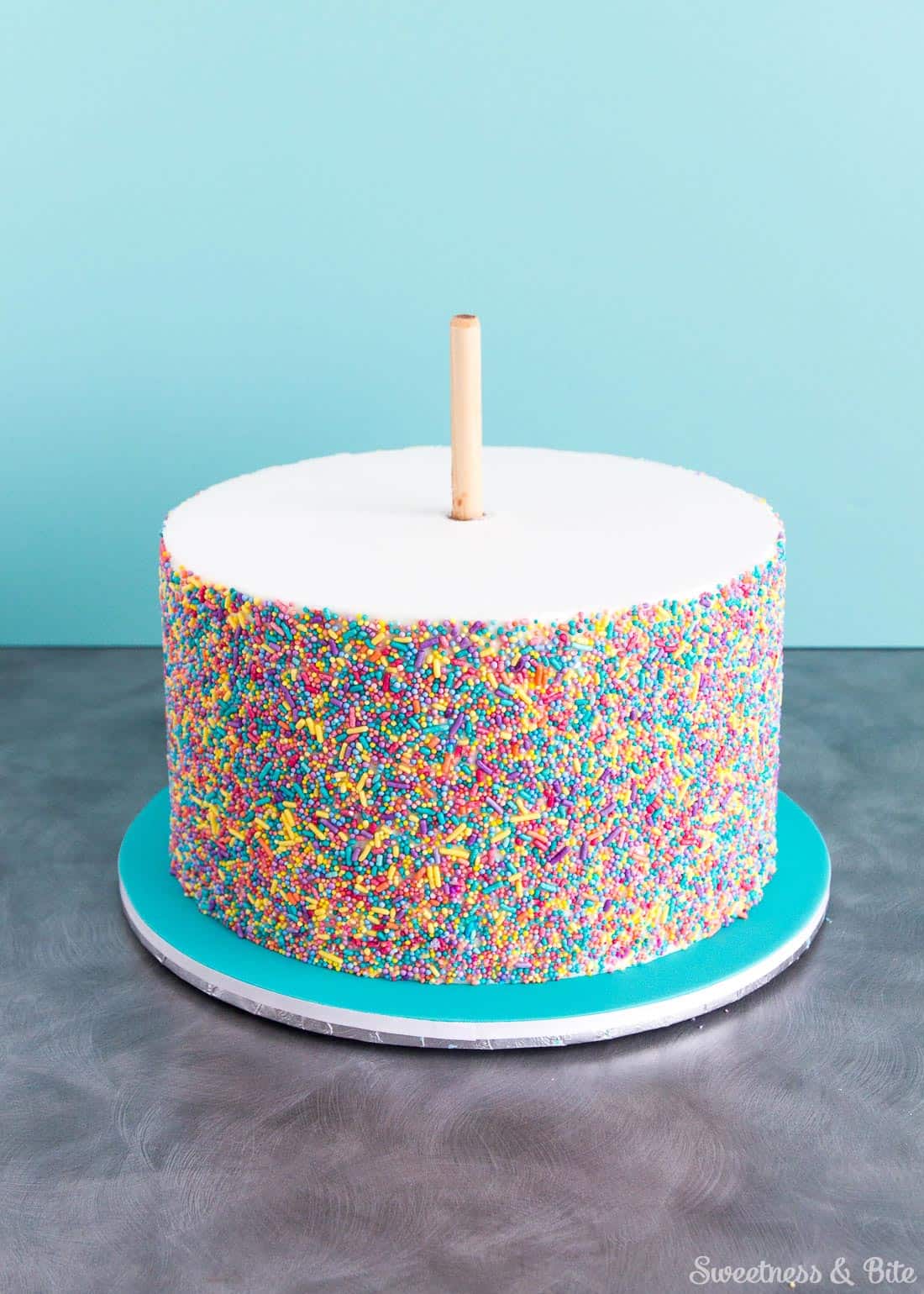 Sprinkle Cake Tutorial - A step by step guide to applying sprinkles to a fondant covered cake ~ Sweetness and Bite