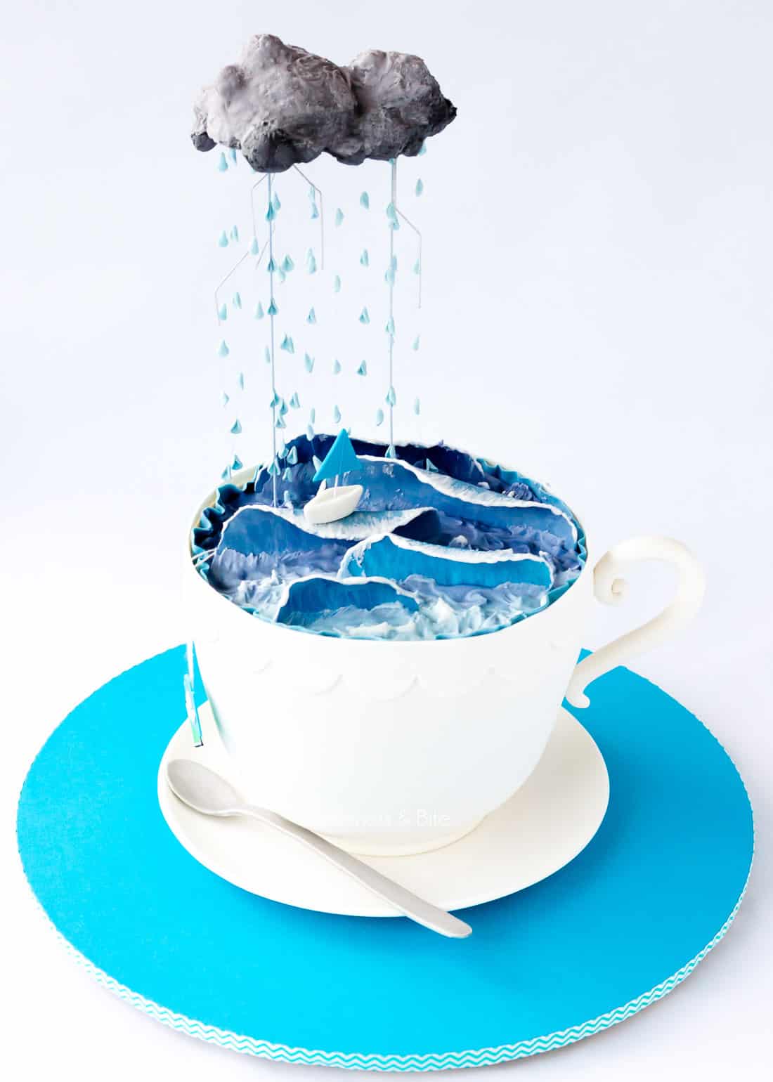 A "Storm in a Teacup" cake - cake in the shape of a teacup, with decorated with waves and rainclouds.