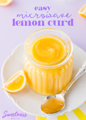 Microwave lemon curd in a ribbed glass jar, with a silver spoon on a purple background.