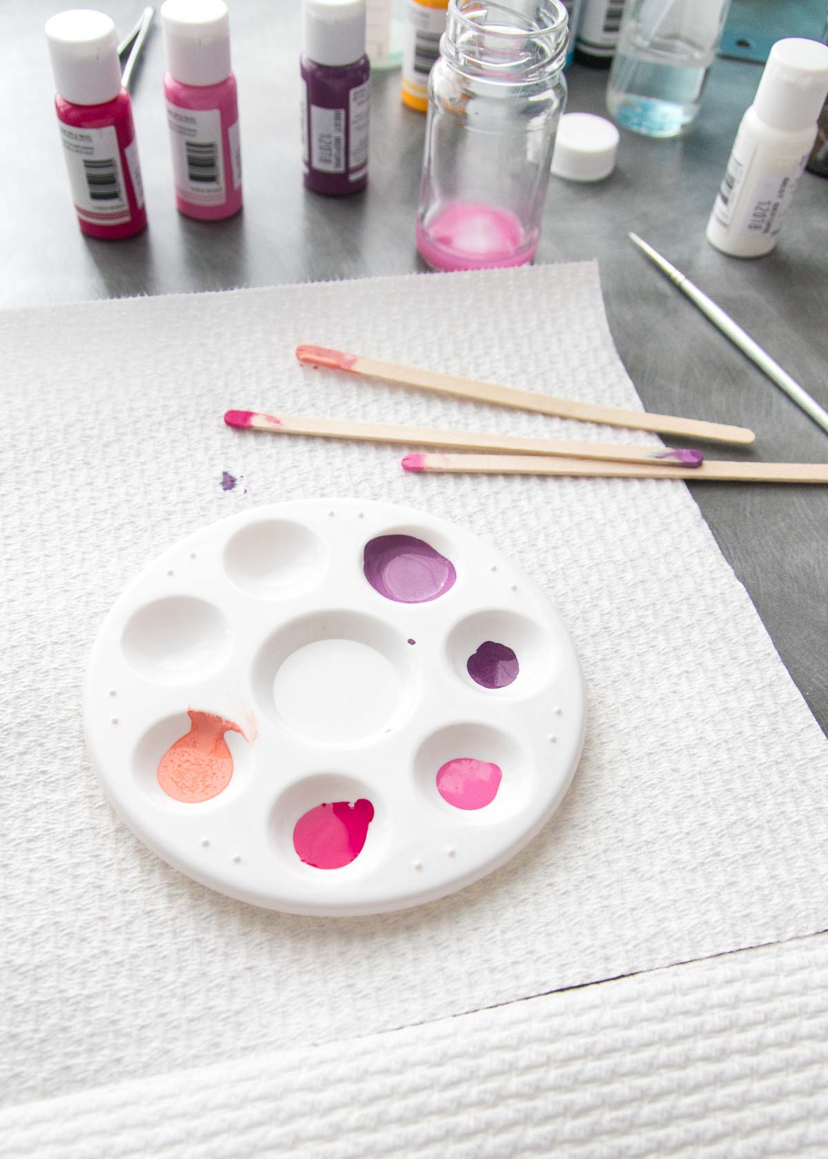 A paint palette with drops of edible art paint.