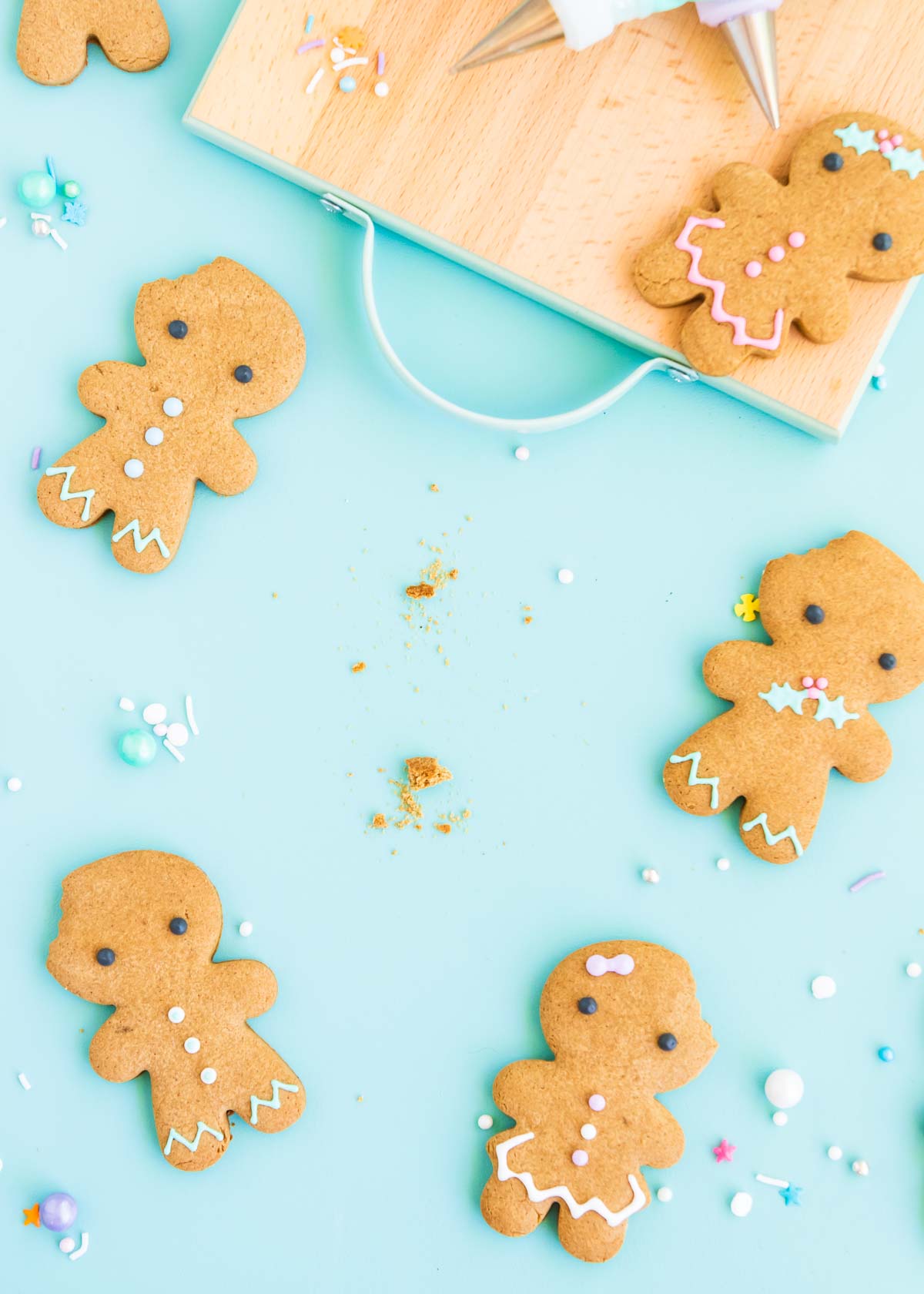 Gluten free gingerbread cookies with one missing and crumbs in its place.