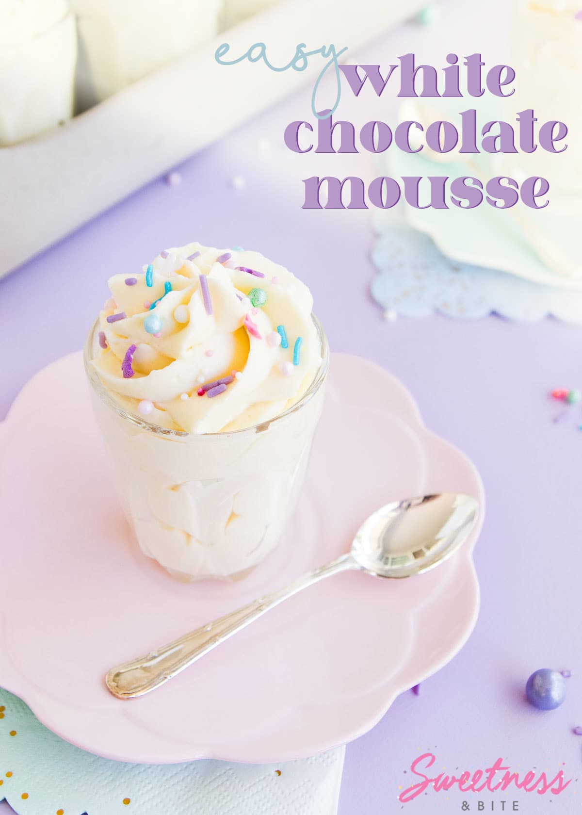 A small glass of mousse, on a pale pink plate against a purple background, text overlay reads 