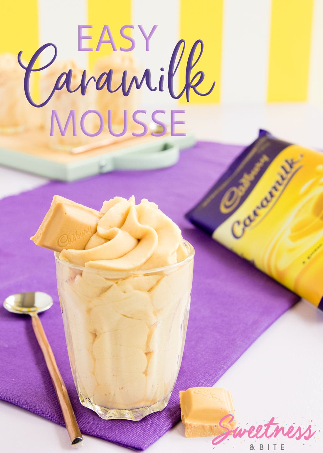 Mousse piped in a swirl into a small glass, with a block of Caramilk chocolate in the background. Text overlay reads: Easy Caramilk Mousse.