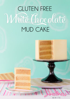 A white chocolate mud cake covered in white chocolate ganache.
