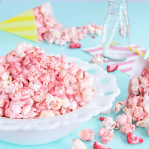 White bowl of pink fruit-flavoured popcorn.