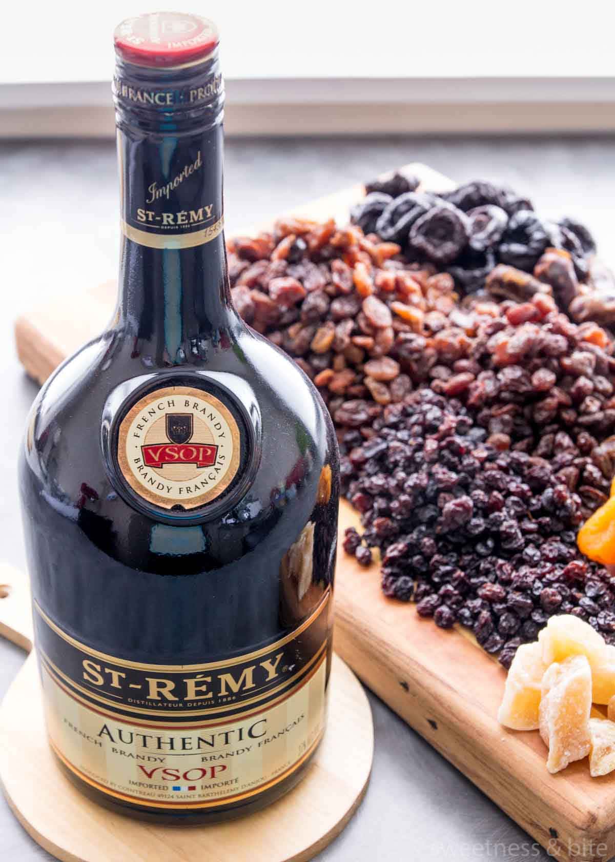 A bottle of St Remy brandy with dried fruits in the background.