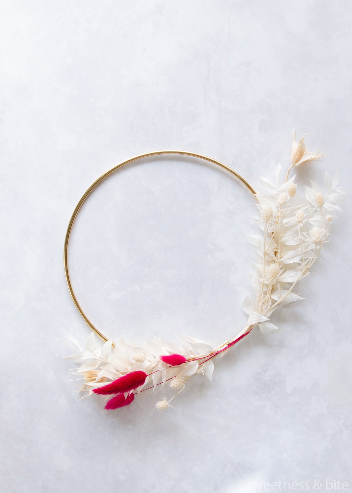 Adding hot pink "bunny tails" to the lower part of the design.