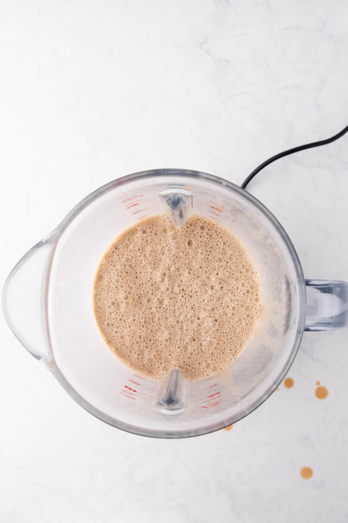 Overhead view of the blended shake in the blender jug.