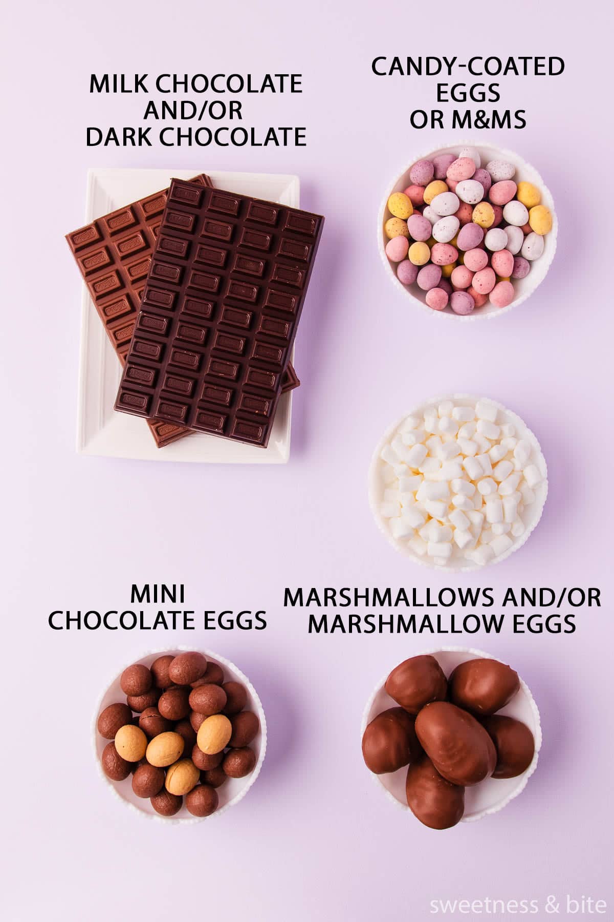 The rocky road ingredient - bars of milk and dark chocolate, and white bowls of mini eggs, marshmallow eggs and mini marshmallows, on a light purple background with black text labels.